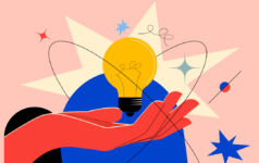 Photo of a hand under a floating lightbulb, representing new ideas, thoughts, and innovation.