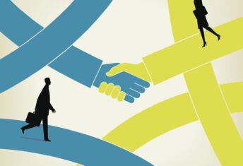 Illustration of two hands shaking with two business people walking by. Source - Getty