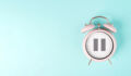 Alarm clock with pause sign, take a break, menopause concept, hormone replacement therapy