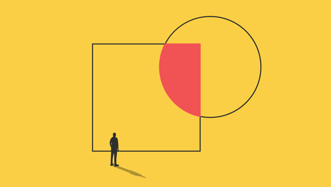 a silhouette of a person stands before a giant square that is overlapped by a circle, their overlap coloured in red