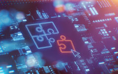 Picture of a computer screen showing a jigsaw puzzle, representing tech M&A.