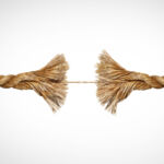 A broken rope held together by a single thread