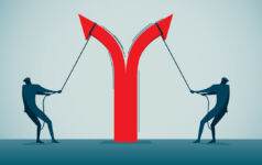 two businessmen pull apart an arrow, causing it to point in opposite directions